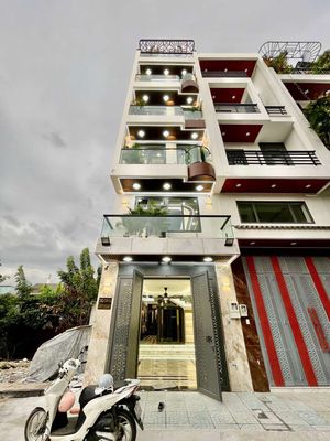 Bán nhà 5 tầng thang máy 4x17m gần chợ Lạc Quang Quận 12 — ảnh 1